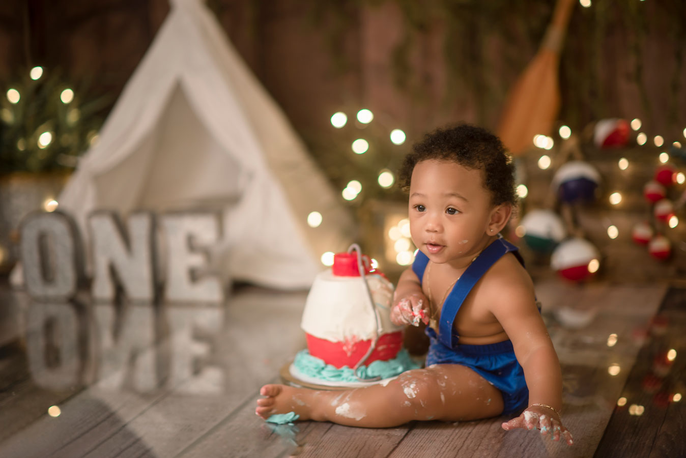 Gone fishing first birthday cake smash ofishally one boy cake smash ideas Roseville Rocklin Sacramento Folsom Elk Grove Eldorado hills cake smash photographer Fishing party decorations ideas